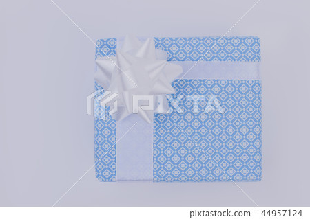 Light blue gift box with white bow. Light blue gift box with white bow. 44957124