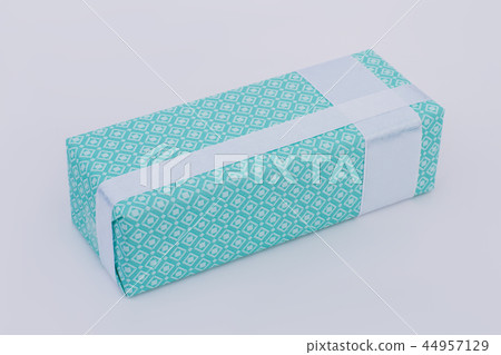 Gift box wrapped in beautiful turquoise paper. Gift box wrapped in beautiful turquoise paper. 44957129