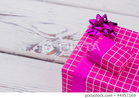 Beautiful present box on wooden background. 44957169