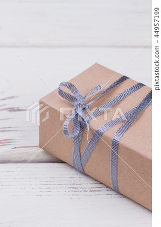 Gift box wrapped in craft paper. 44957199