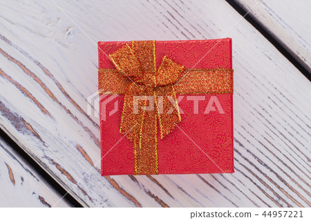 Red jewelry gift box on wooden background. 44957221