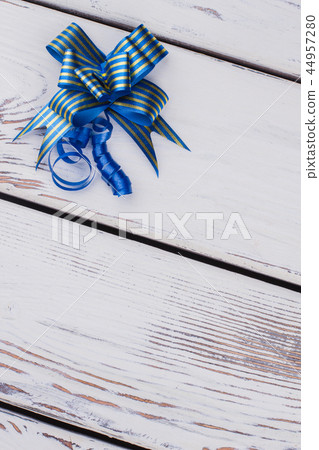 Decorative blue ribbon and bow. Decorative blue ribbon and bow. 44957280