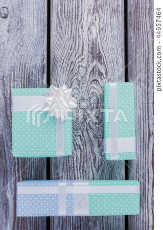 Christmas presents on wooden background. Christmas presents on wooden background. 44957464