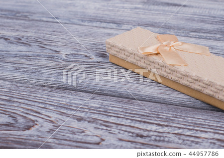 Jewelry gift box on gray wooden background. Jewelry gift box on gray wooden background. 44957786