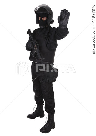 SWAT officer with assault rifle in black uniform SWAT officer with assault rifle in black uniform 44957870