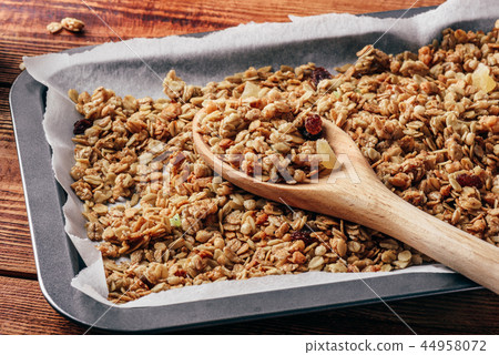 Homemade granola on baking sheet Homemade granola on baking sheet 44958072