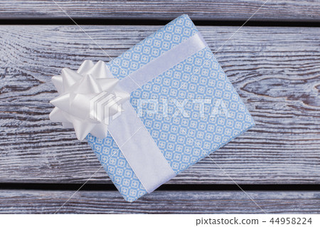 Gift box with white satin ribbon. 44958224