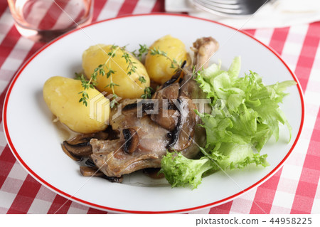 Roasted duck leg with vegetables 44958225