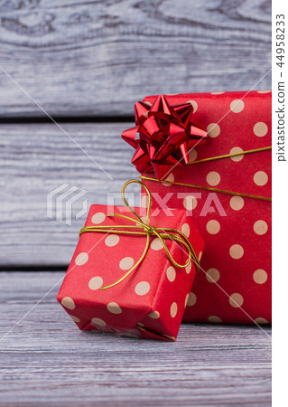 Beautiful gifts on wooden background. Beautiful gifts on wooden background. 44958233
