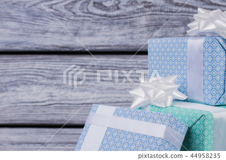 Gift boxes on wooden background. Gift boxes on wooden background. 44958235