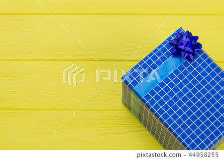 Blue checkered gift box and copy space. Blue checkered gift box and copy space. 44958255
