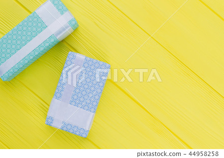 Gift boxes with beautiful design on yellow background. Gift boxes with beautiful design on yellow background. 44958258