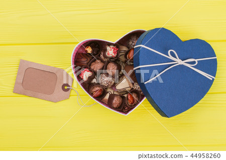 Box of chocolate and blank price tag. Box of chocolate and blank price tag. 44958260