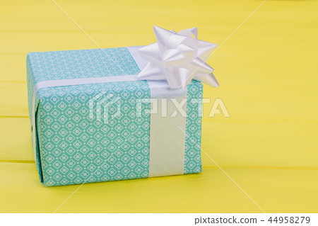 Beautiful gift box with white bow. Beautiful gift box with white bow. 44958279