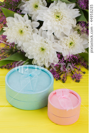 Jewelry gift boxes and bouquet of flowers. Jewelry gift boxes and bouquet of flowers. 44958285