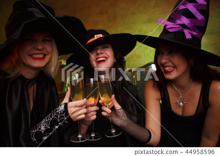 Image of three happy witches with glass with wine Image of three happy witches with glass with wine 44958596