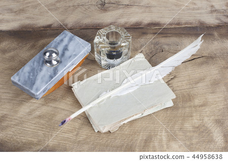 Old fountain pen and inkwell with old letters  44958638