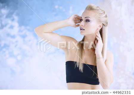 professional make-up model studio / model posing in studio with bright fresh make-up, beautiful eyes and lips with makeup 44962331