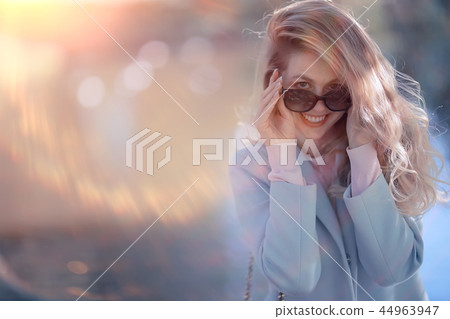 walk in autumn park / beautiful girl in autumn park, model female happiness and fun in yellow trees October 44963947