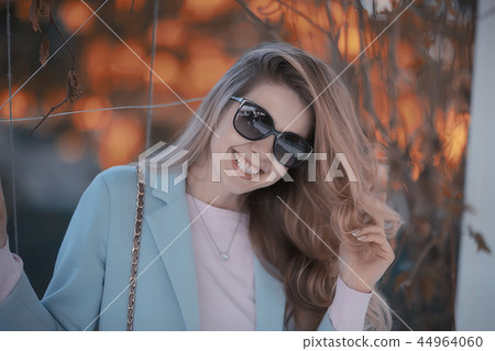 autumn girl / portrait of a girl in an autumn city park, walk happy weekend female portrait autumn girl / portrait of a girl in an autumn city park, walk happy weekend female portrait 44964060