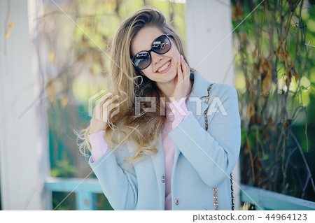 summer girl outdoor air / cheerful adult girl model on a summer walk in the city park, happiness, pleasure freedom 44964123