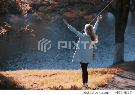 walk in autumn park / beautiful girl in autumn park, model female happiness and fun in yellow trees October walk in autumn park / beautiful girl in autumn park, model female happiness and fun in yellow trees October 44964637