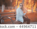 walk in autumn park / beautiful girl in autumn park, model female happiness and fun in yellow trees October 44964711