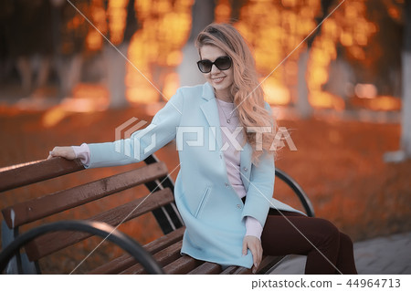 walk in autumn park / beautiful girl in autumn park, model female happiness and fun in yellow trees October walk in autumn park / beautiful girl in autumn park, model female happiness and fun in yellow trees October 44964713