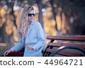 walk in autumn park / beautiful girl in autumn park, model female happiness and fun in yellow trees October 44964721
