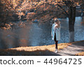 shore pond park adult girl / walk in city park, beautiful girl near pond in urban outdoor recreation area 44964725