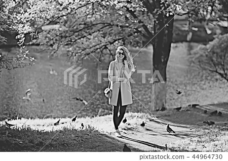 shore pond park adult girl / walk in city park, beautiful girl near pond in urban outdoor recreation area 44964730