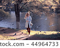 shore pond park adult girl / walk in city park, beautiful girl near pond in urban outdoor recreation area 44964733