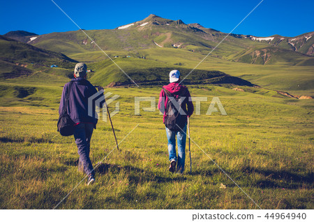 hikers with backpacks and trekking  44964940