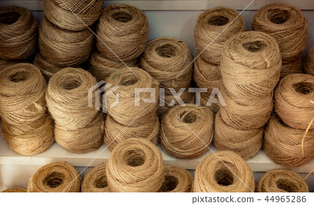 Spools or rolls of brown color linen string 44965286