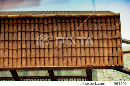 Traditional roof icovered with tiles made of wood Traditional roof icovered with tiles made of wood 44965392