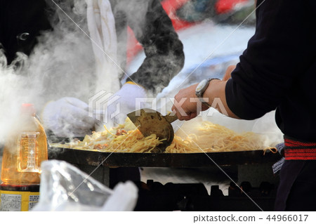 People baking yakisoba at the food court of a local event 44966017