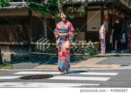 tourist walking out from the kimono store tourist walking out from the kimono store 44966867