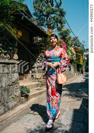lady wearing kimono going to temple for blessing lady wearing kimono going to temple for blessing 44966873