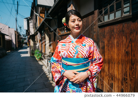 Japanese girl with kimono standing in old city 44966879