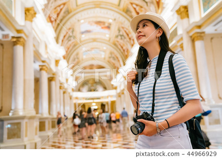 photographer looking up to the classic ceiling 44966929