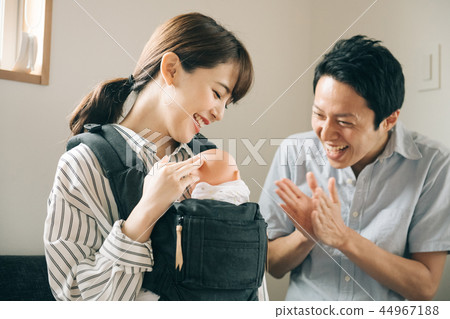 Young couple raising up their baby Parenting Family 44967188