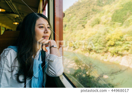 beautiful lady sitting in the sightseeing train beautiful lady sitting in the sightseeing train 44968017