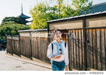 female tourist walking around the wall female tourist walking around the wall 44968058