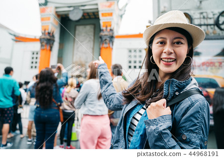 female traveler wearing straw hat 44968191