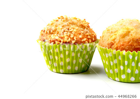 Assorted with Delicious homemade cupcakes with raisins and chocolate isolated on white background Assorted with Delicious homemade cupcakes with raisins and chocolate isolated on white background 44968266
