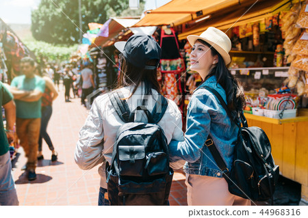 tourists visiting the traditional market 44968316