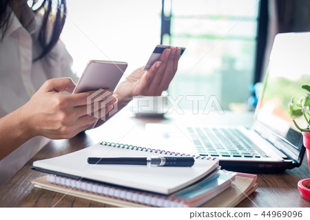 shopping online concept.woman holding credit card shopping online concept.woman holding credit card 44969096
