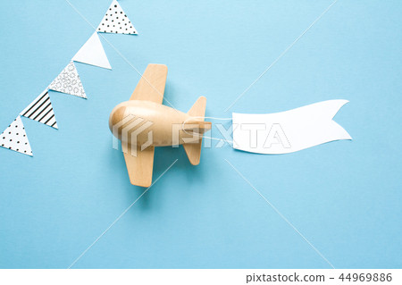 Children's wooden plane in the sky carries Children's wooden plane in the sky carries 44969886