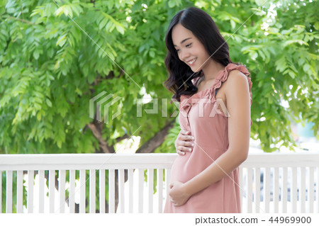 woman has a pregnancy baby inside. 44969900