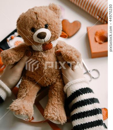Woman preparing teddy bear toy and gift Woman preparing teddy bear toy and gift 44970280